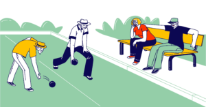 Two people are playing lawn bowls and are being watched by two people sitting on a bench